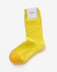 Alamo yellow cotton crew sock with Hooray label tag – showcasing the two-tone design and craftsmanship.