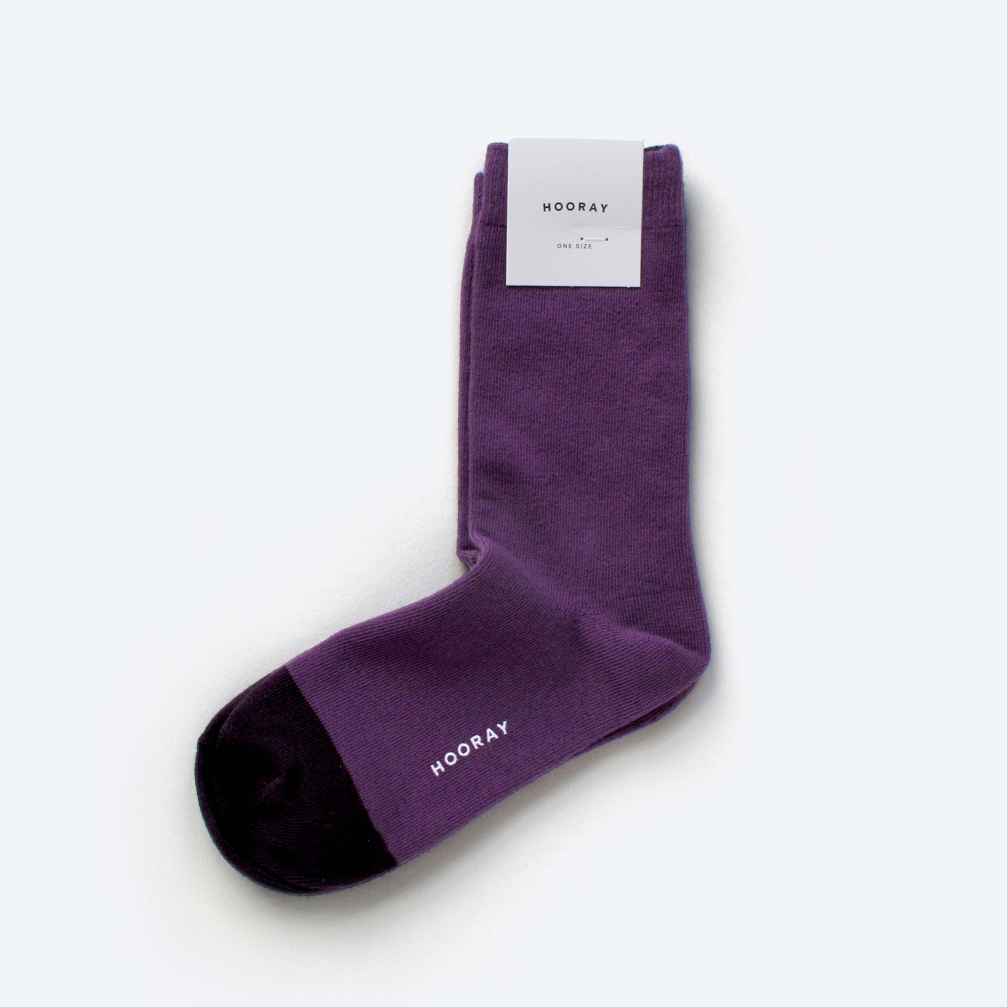 Ina purple cotton crew sock with Hooray label tag – showcasing the two-tone design and craftsmanship.