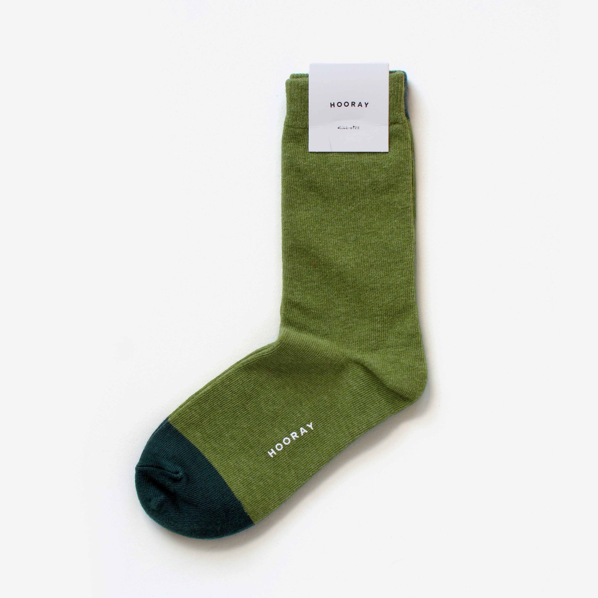 Lafayette moss green cotton crew sock with Hooray label tag – showcasing the two-tone design and craftsmanship.
