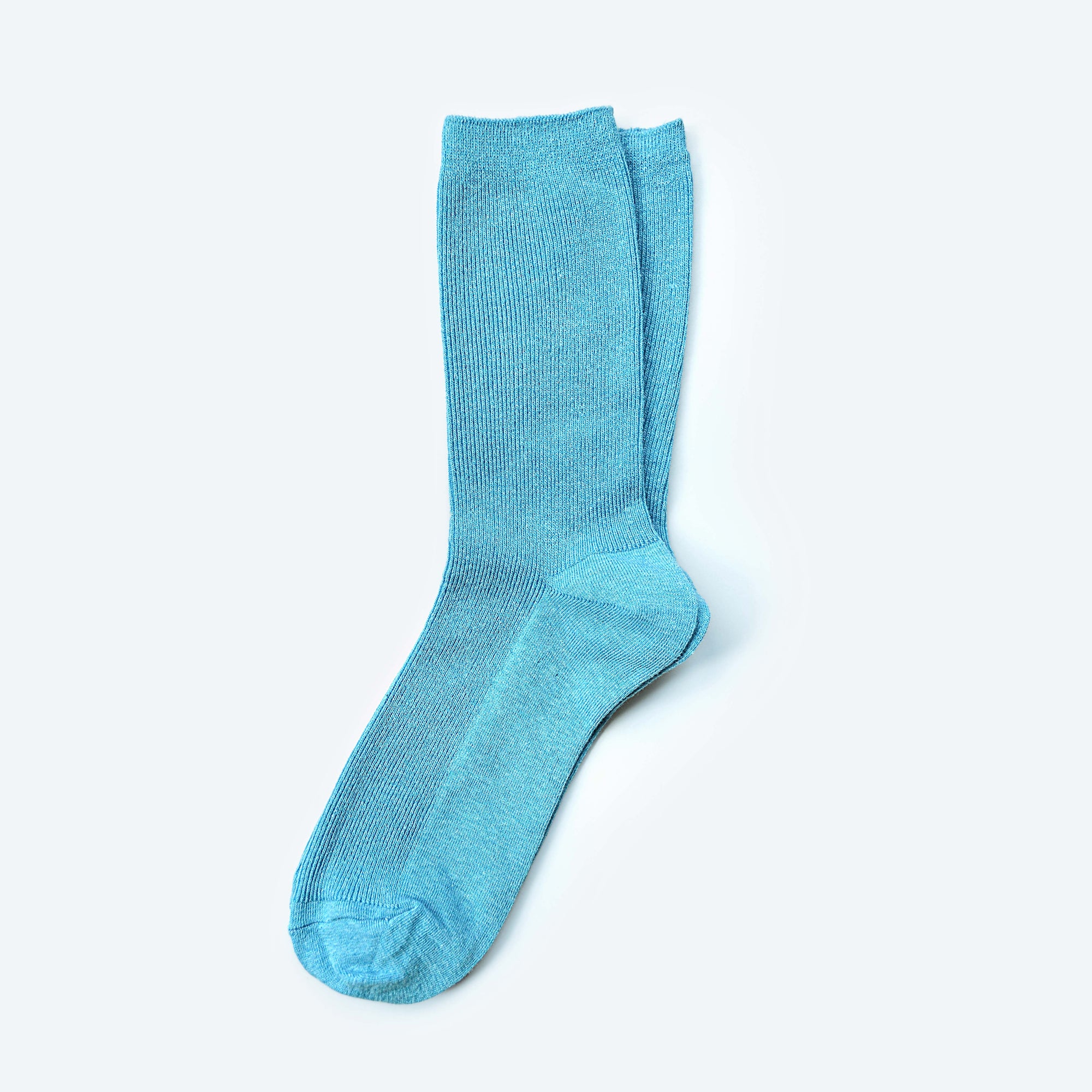 Hooray Sock Co.'s Sky Crew Socks: Everyday comfort in Sky Blue. Unisex design, shorter crew length. 80% cotton, 20% spandex. Made in South Korea. Size: Small (Women's 4-10). 